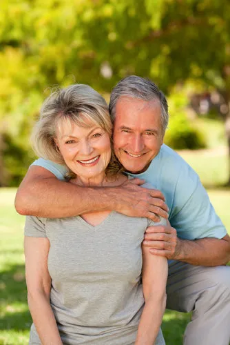 Older couple posing for photo