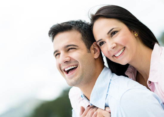 Couple smiling looking into the distance
