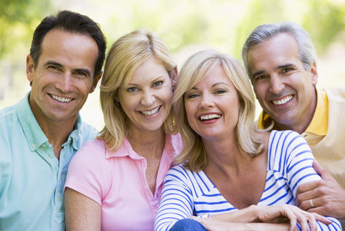 Family smiling at camera for a photo
