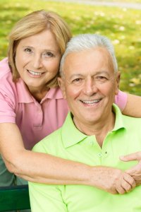 Couple outside posing for photo