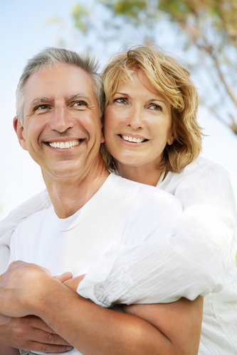 Older couple posing together