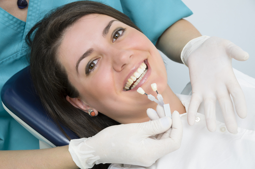 Woman receiving veneer comparison 