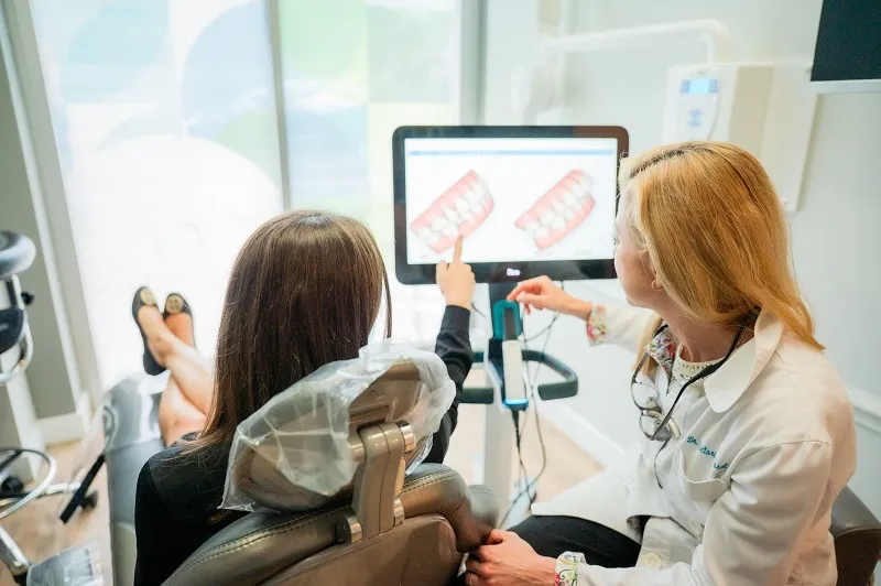Doctor showing digital teeth scans